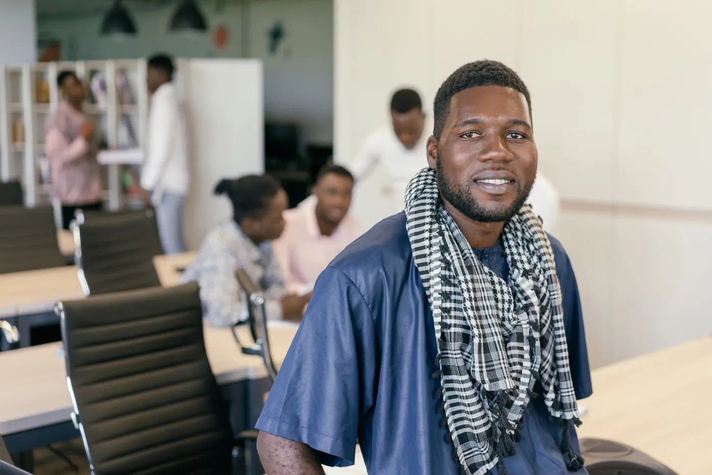 An African founder working at a desk
