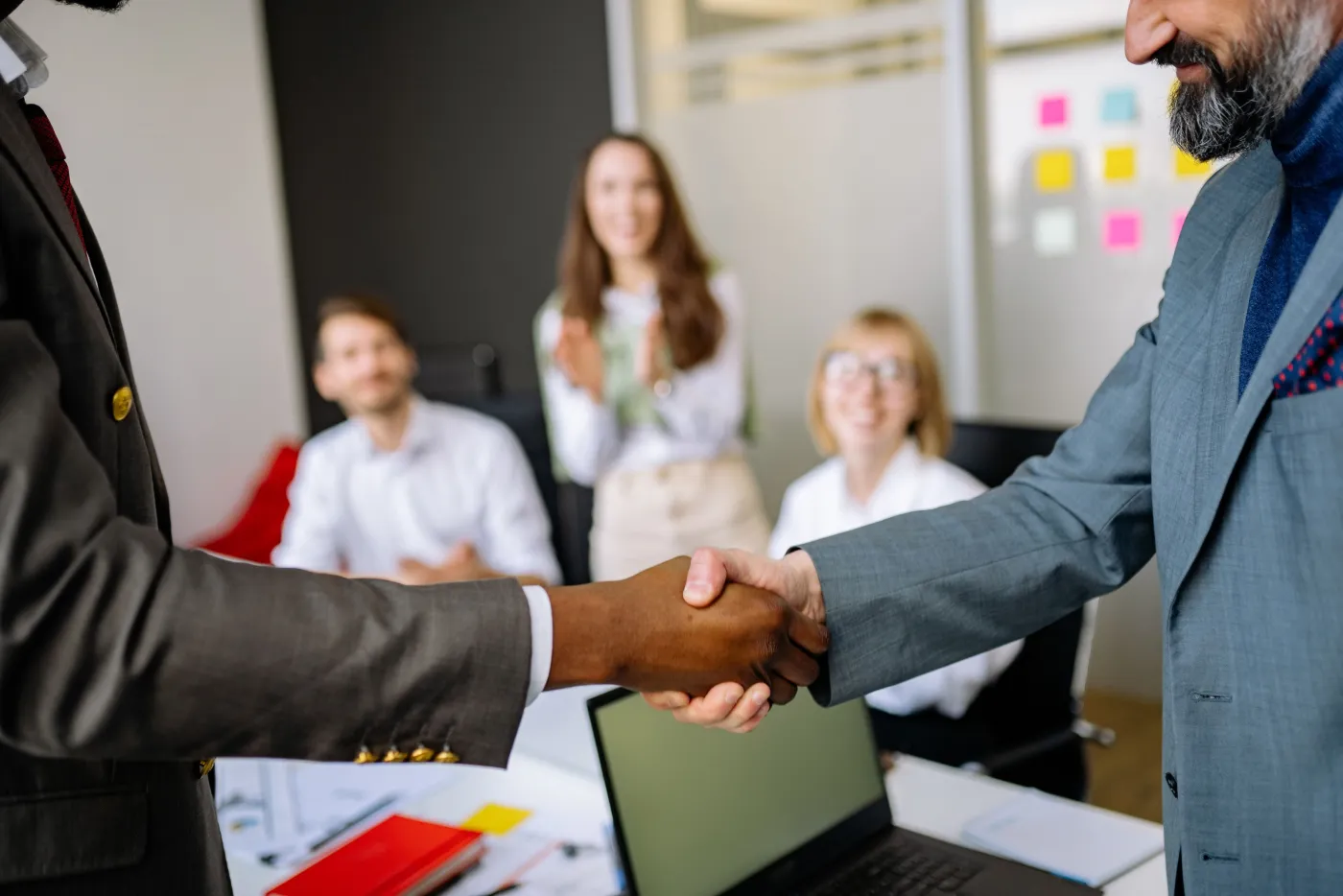 Two African business people shaking hands
